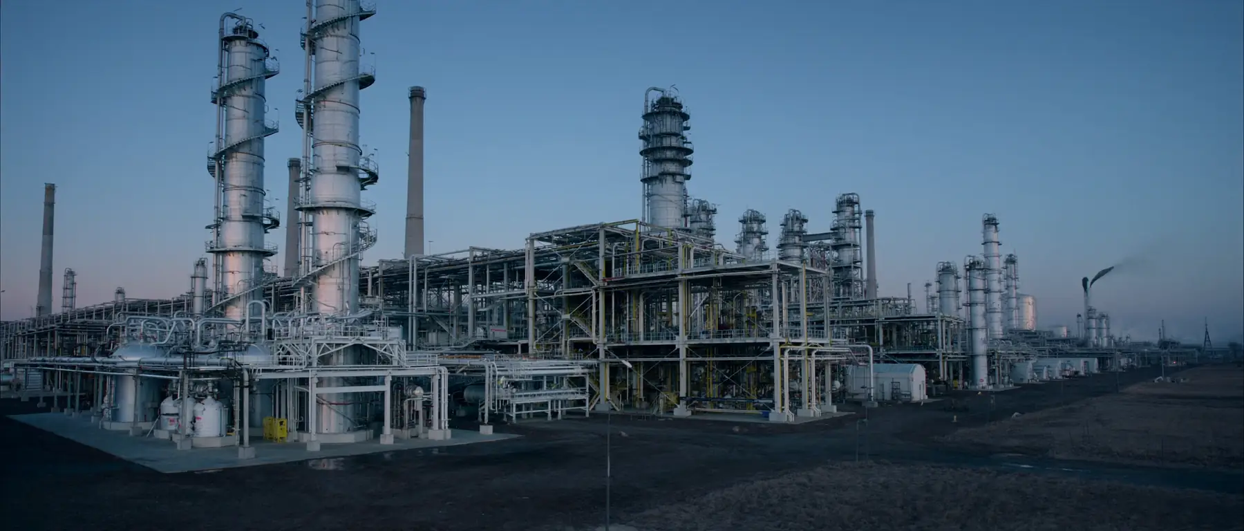 Refinery process units and columns at dusk